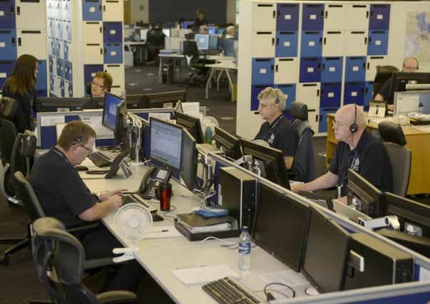 Staff answer calls at the Police Scotland control room at Bilston Glen.