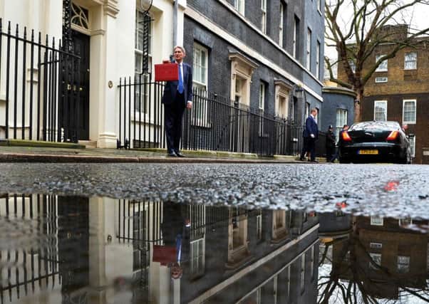 Chancellor Philip Hammond poses for pictures with the Budget Box as he leaves 11 Downing Street. Picture: AFP/Getty Images