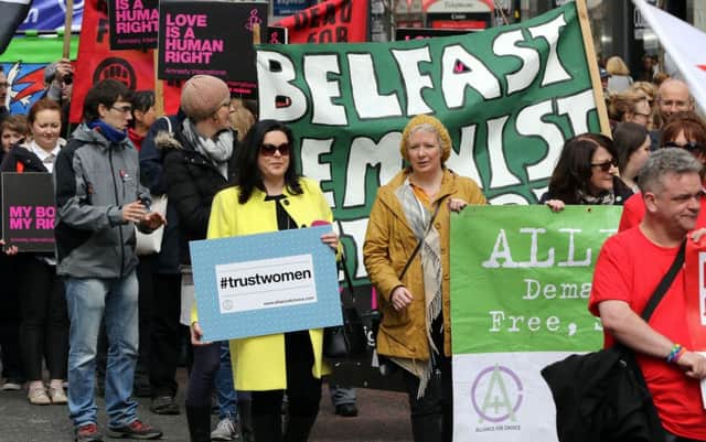 Pro choice campaigners take part in a demonstration through Belfast city centre on April 30, 2016.
Abortion prosecutions in Northern Ireland have forced the issue to centre of the campaign ahead of next week's regional elections, with unprecedented political support for an end to the current ban. Northern Ireland currently bans abortion in all cases except when the life of the mother is in danger / AFP / PAUL FAITH        (Photo credit should read PAUL FAITH/AFP/Getty Images)