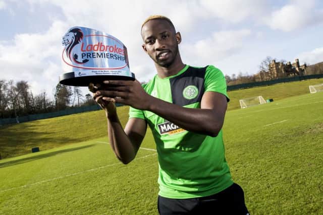 Moussa Dembele receives the Ladbrokes Player of the Month award for February