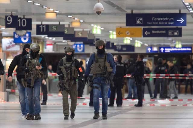 Special police commandos arrive at the main train station in Duesseldorf FEDERICO GAMBARINI/AFP/Getty Images