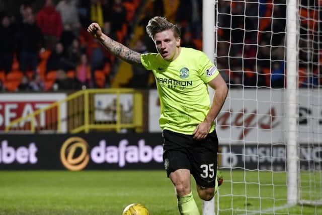 Jason Cummings salutes his goal during Fridays defeat of Dundee United. Picture: SNS.