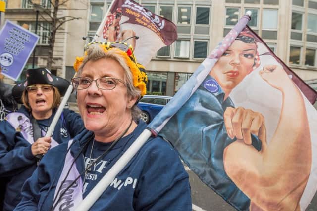 A demonstrator with Waspi, or Women Against State Pension Inequality, outside the Houses of Parliament. Photograph: Alamy