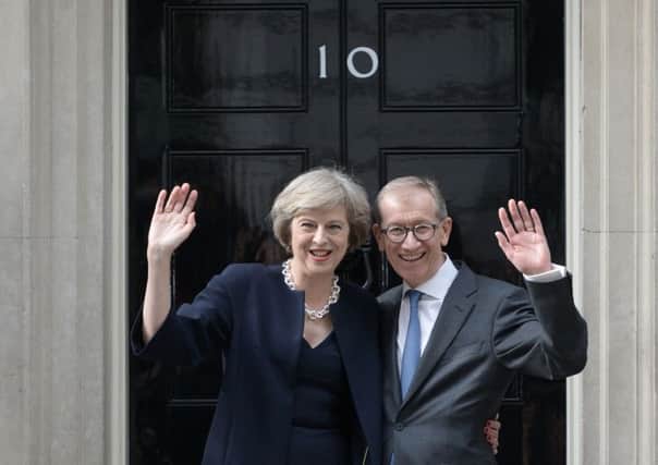 Theresa May with her husband Philip at 10 Downing Street on the day she took office in July last year. Photograph: Oli Scarff/Getty