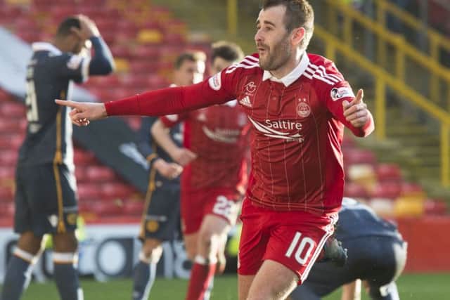 Aberdeens Niall McGinn celebrates after his extra-time goal sealed victory for Aberdeen. Photograph: Craig Foy/SNS