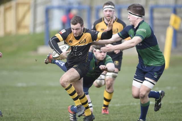 Curries Jamie Forbes tries to break through the Boroughmuir defence. Picture: Greg Macvean
