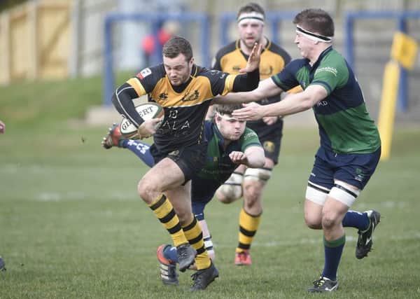 Curries Jamie Forbes tries to break through the Boroughmuir defence. Picture: Greg Macvean