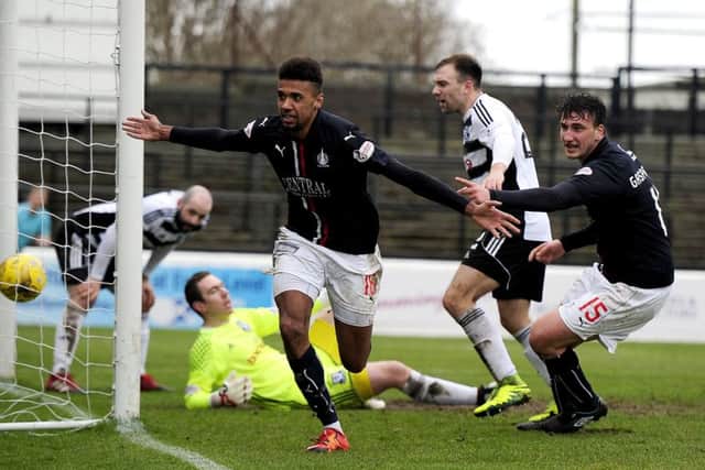 Nathan Austin wheels away afte4r scoring Falkirks second goal. Picture: Michael Gillen