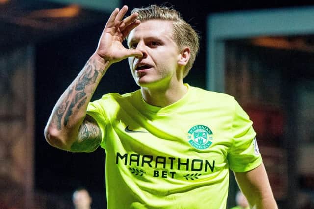 Jason Cummings goal was the difference but was thankful for his team mates after being sent off. Picture: SNS/Ross Parker