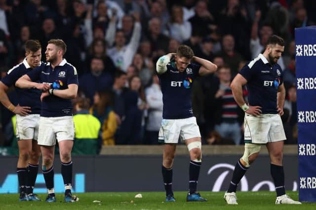 Scotland players left dejected after a harrowing RBS Six Nations loss to England at Twickenham. Picture: Michael Steele/Getty Images