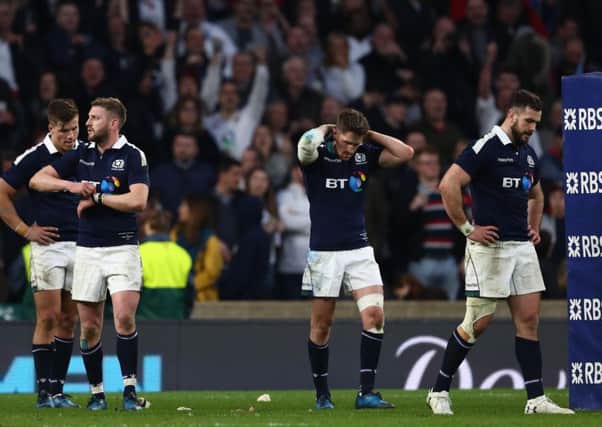 Scotland players left dejected after a harrowing RBS Six Nations loss to England at Twickenham. Picture: Michael Steele/Getty Images