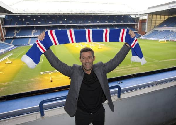 Pedro Caixinha poses at Ibrox after being confirmed as the new Rangers manager on a three-year deal. Picture: Kirk O'Rourke/Rangers FC/Press Association Images