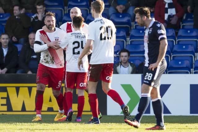 Kilmarnock striker Kris Boyd, left, celebrates his late winner in Dingwall. Picture: Paul Devlin/SNS