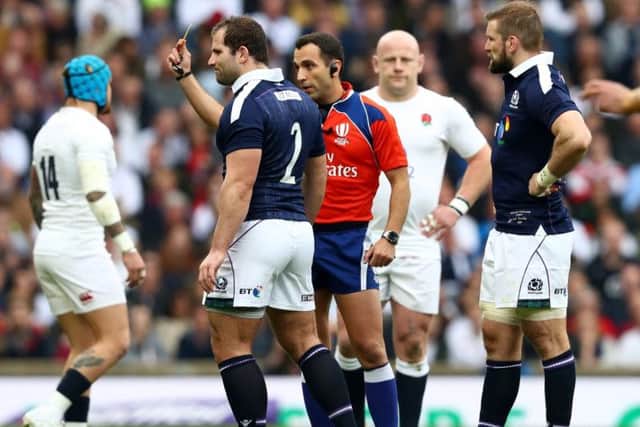 Fraser Brown is yellow-carded just two minutes into the game. Scotland conceded ten points while he was off. Picture: Michael Steele/Getty