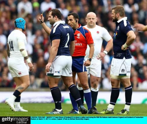 Fraser Brown is yellow-carded just two minutes into the game. Scotland conceded ten points while he was off. Picture: Michael Steele/Getty