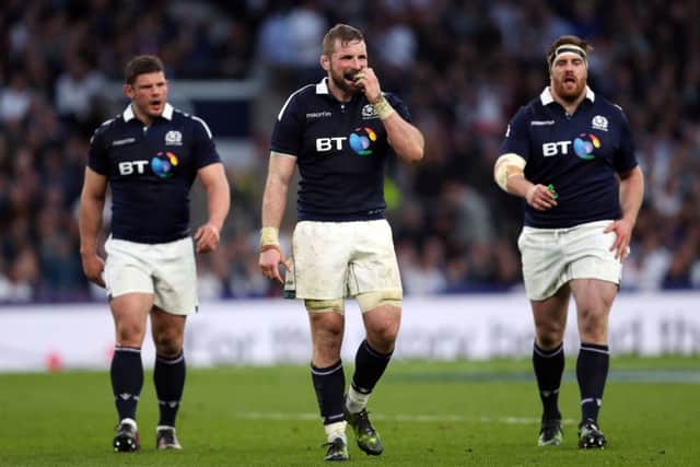 Scotland captain John Barclay, centre, stands dejected at Twickenham. Picture: David Davies/PA