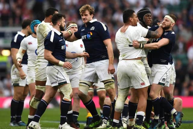 Nathan Hughes and Finn Russell, right, confront each other. Photograph: Getty Images