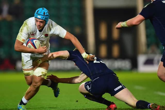 Craig Pringle tackles Zach Mercer of England. Picture: Tony Marshall/Getty Images
