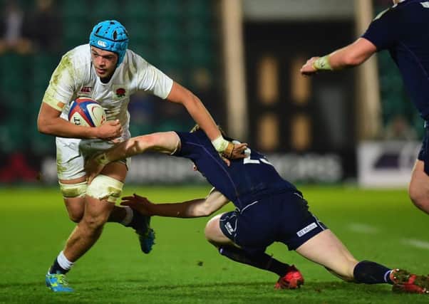 Craig Pringle tackles Zach Mercer of England. Picture: Tony Marshall/Getty Images
