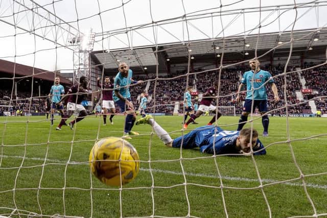 Arnaud Djoum turns away to celebrate scoring Hearts opening goal in their victory over Hamilton. Picture: SNS.