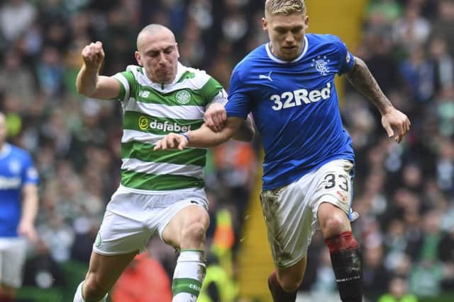 12/03/17 LADBROKES PREMIERSHIP
 CELTIC v RANGERS
 CELTIC PARK - GLASGOW
 Celtic's Scott Brown (left) with Martyn Waghorn