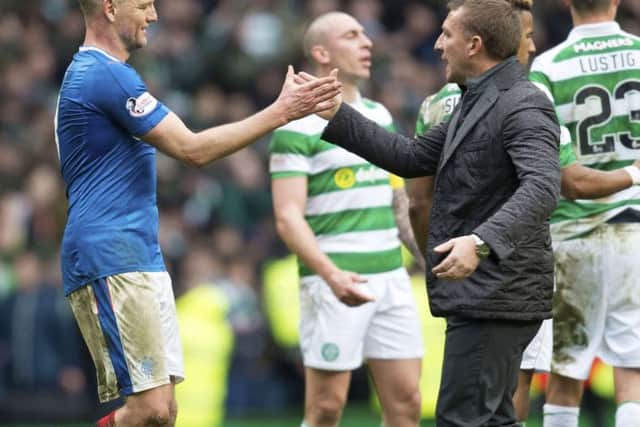 Clint Hill and Brendan Rodgers  embrace at full time. Picture: SNS/Rob Casey