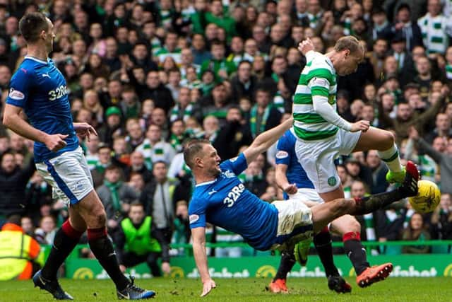 Clint Hill challenges Leigh Griffiths. Picture: SNS/Ross Parker
