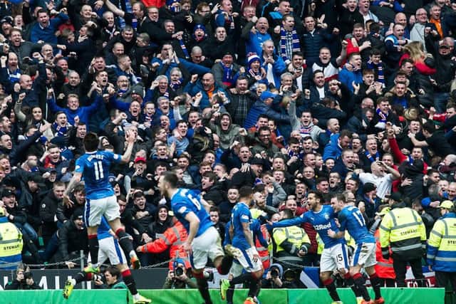 Rangers players and fans celebrate after Clint Hill's late leveller. Picture: John Devlin