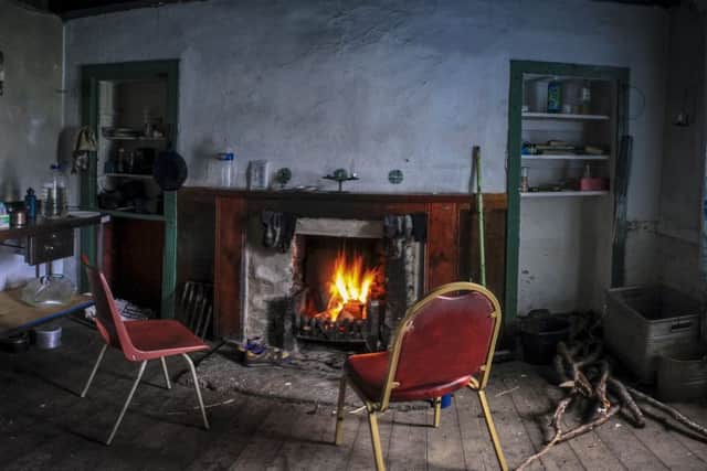 The open fire - known as "Bothy TV" - gets underway at Invermallie in the Western Highlands. PIC: Geoff Allan.