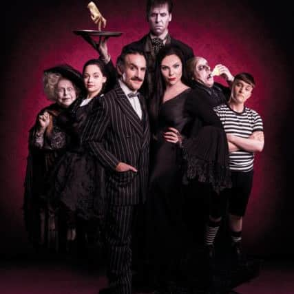 The Addams Family, l-r Valda Aviks, Carrie Hope Fletcher, Cameron Blakely, Dickon Gough, Samantha Womack, Les Dennis and Grant McIntyre. Picture: Matt Martin