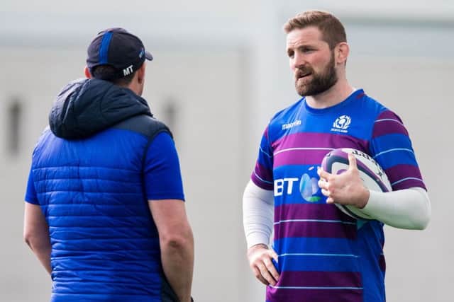 John Barclay talks to Scotland defence coach Matt Taylor in training at Oriam. Picture: SNS