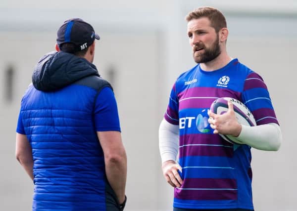 John Barclay talks to Scotland defence coach Matt Taylor in training at Oriam. Picture: SNS