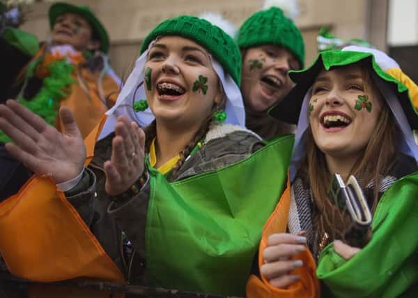 Spectators cheer as the St Patricks Day parade passes in New York. Picture: AP