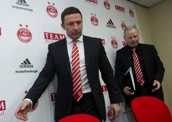 Aberdeen chairman Stewart Milne, right, wants manager Derek McInnes at the helm when the club moves to a new stadium in 2020. Picture: Bill Murray/SNS