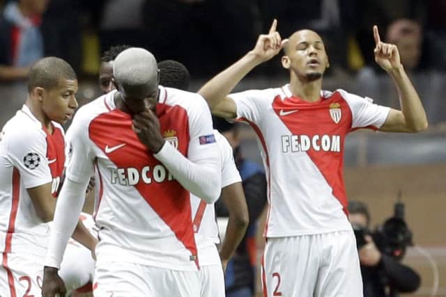 Monaco's Fabinho, right, celebrates his side's second goal against Manchester City at the Stade Louis II. Picture: AP Photo/Claude Paris