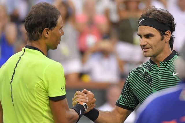 Roger Federer, right, shakes hands with Rafael Nadal after defeating him 6-2, 6-3 at the BNP Paribas Open at Indian Wells. Picture: Mark J. Terrill/AP