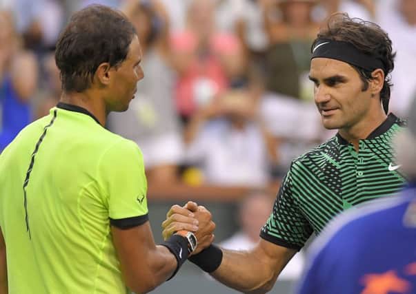 Roger Federer, right, shakes hands with Rafael Nadal after defeating him 6-2, 6-3 at the BNP Paribas Open at Indian Wells. Picture: Mark J. Terrill/AP