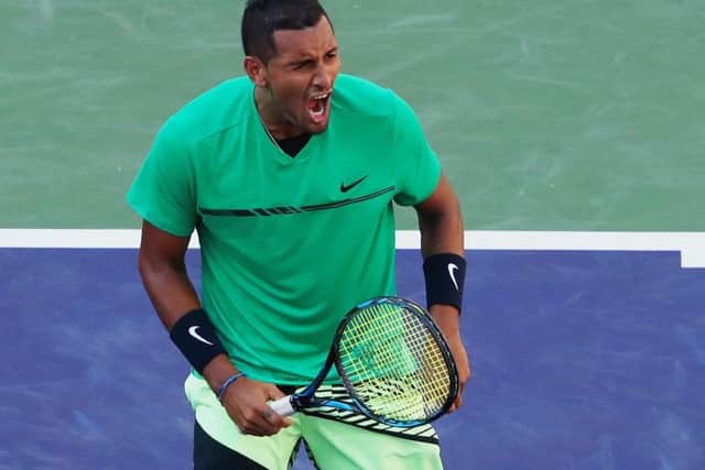 Nick Kyrgios celebrates match point against Novak Djokovic in the fourth round of the BNP Paribas Open at Indian Wells.  Picture: Clive Brunskill/Getty Images