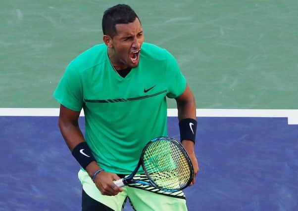 Nick Kyrgios celebrates match point against Novak Djokovic in the fourth round of the BNP Paribas Open at Indian Wells.  Picture: Clive Brunskill/Getty Images