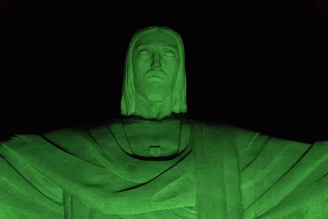 Christ the Redeemer statue is illuminated in green in honor of St. Patrick's Day(AP Photo/Renata Brito)
