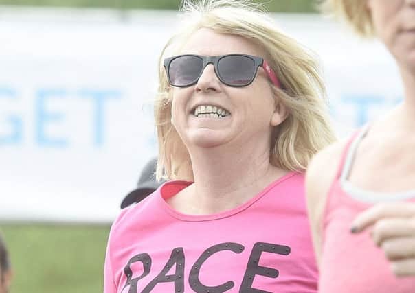 A Race For Life 10k competitor in Holyrood Park. Picture: Greg Macvean