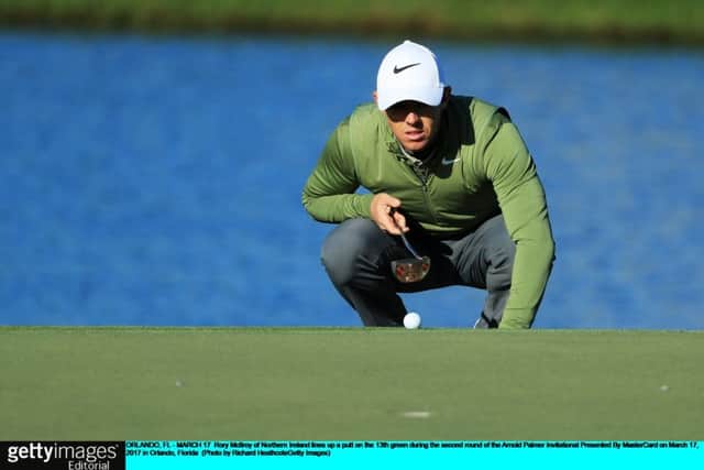 World No 3 Rory McIlroy lines up a putt in the second round of the Arnold Palmer Invitational. Picture: Getty