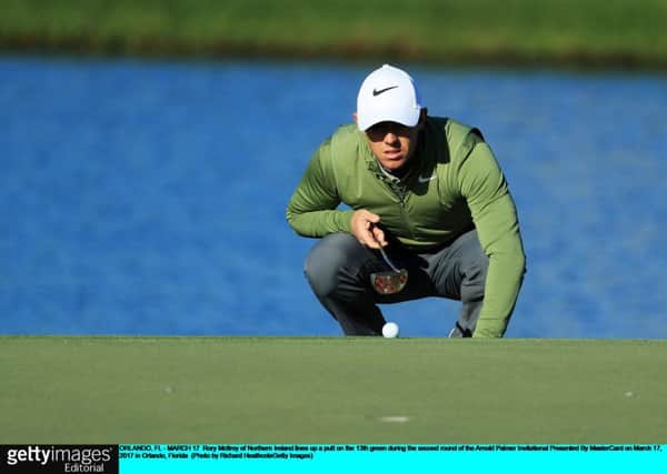 World No 3 Rory McIlroy lines up a putt in the second round of the Arnold Palmer Invitational. Picture: Getty