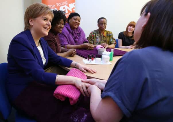 First Minister Nicola Sturgeon visits a Glasgow Young Womens Movement centre. Picture: PA