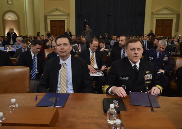 FBI director James Comey, left, and National Security Agency director Michael Rogers at the Congressional hearing. Picture: AFP/Getty Images