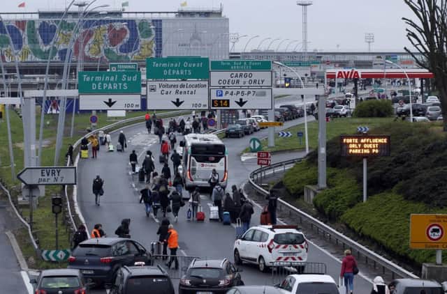 A man was shot to death Saturday after trying to seize the weapon of a soldier guarding Paris' Orly Airport, prompting a partial evacuation of the terminal, police said. (AP Photo/Thibault Camus)