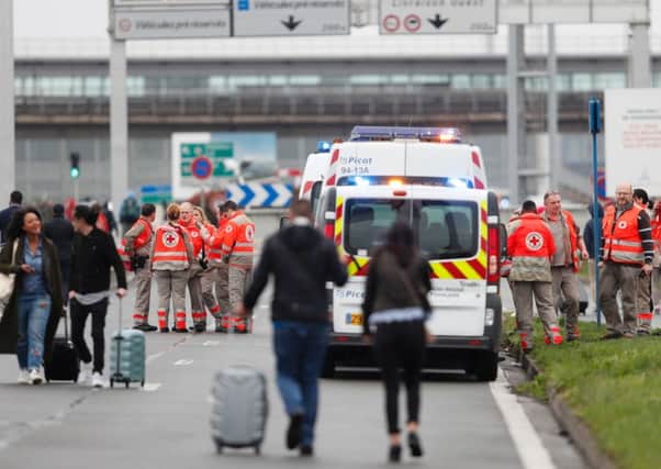 French Red Cross workers stand by as travellers are evacuated from Paris' Orly airport. Picture: Getty