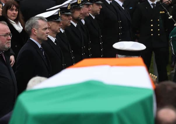 Members of the Coast Guard form a guard of honour as the coffin arrives for the funeral of Captain Dara Fitzpatrick (Photo: Brian Lawless/PA Wire)