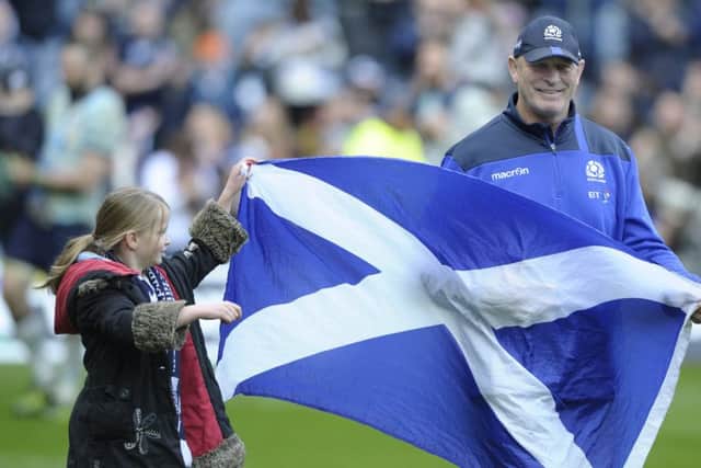 Flying them flag: Vern Cotter with his daughter Arabella , eight, on the teams 
lap of honour. Photograph: Neil Hanna