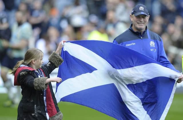 Flying them flag: Vern Cotter with his daughter Arabella , eight, on the teams 
lap of honour. Photograph: Neil Hanna